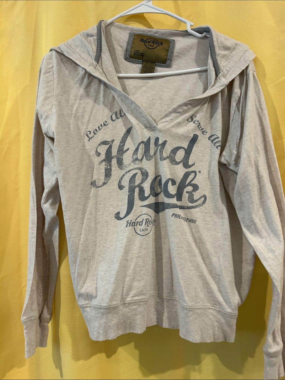 Hard Rock Cafe light gray hooded long sleeve with faded dark gray logo